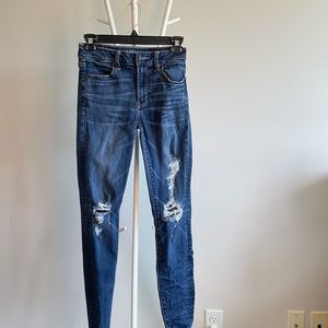 High-Rise Ripped Jeans
